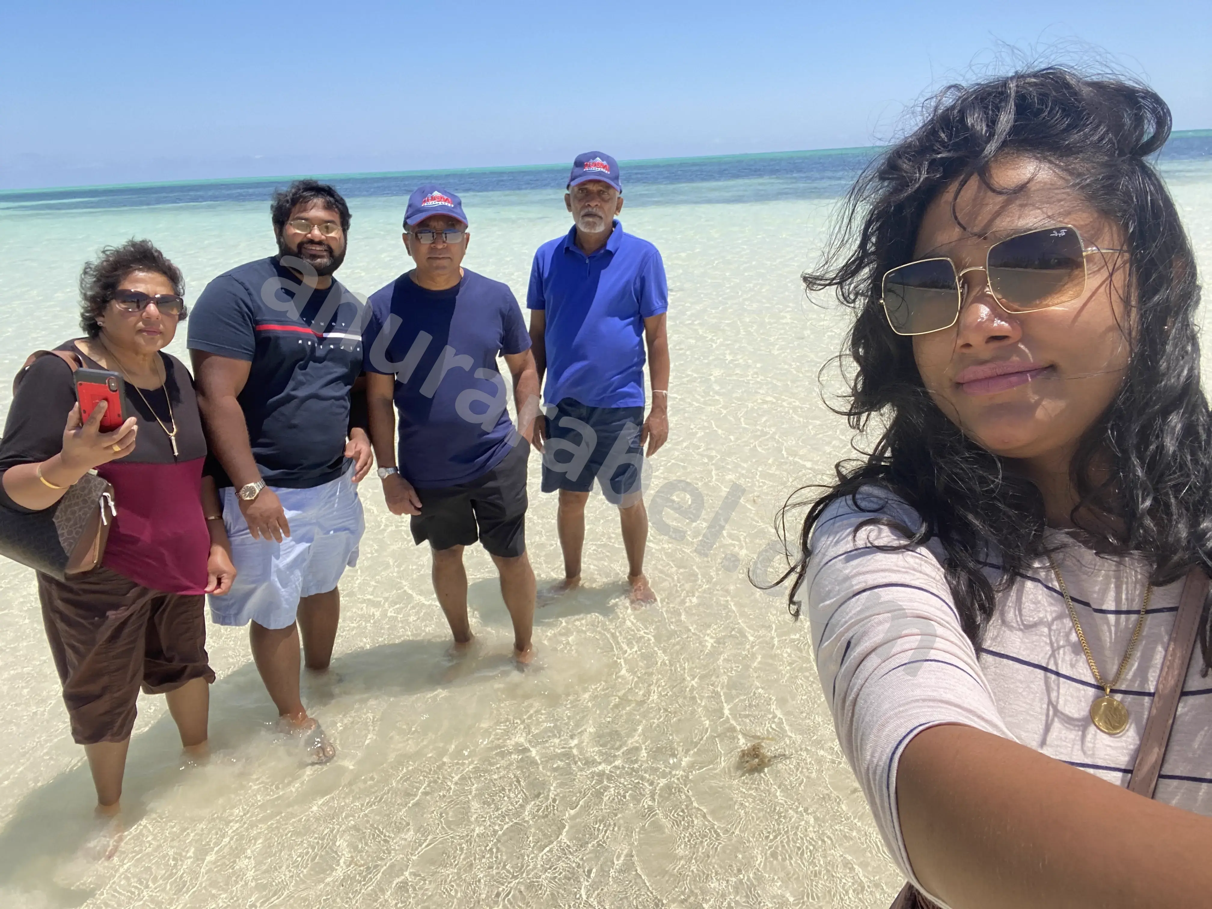 Anura with family Jayamini, Chamara, Ruwanthi, and Ruwanthi's dad at Banana Bay beach in Grand Bahama, Bahamas