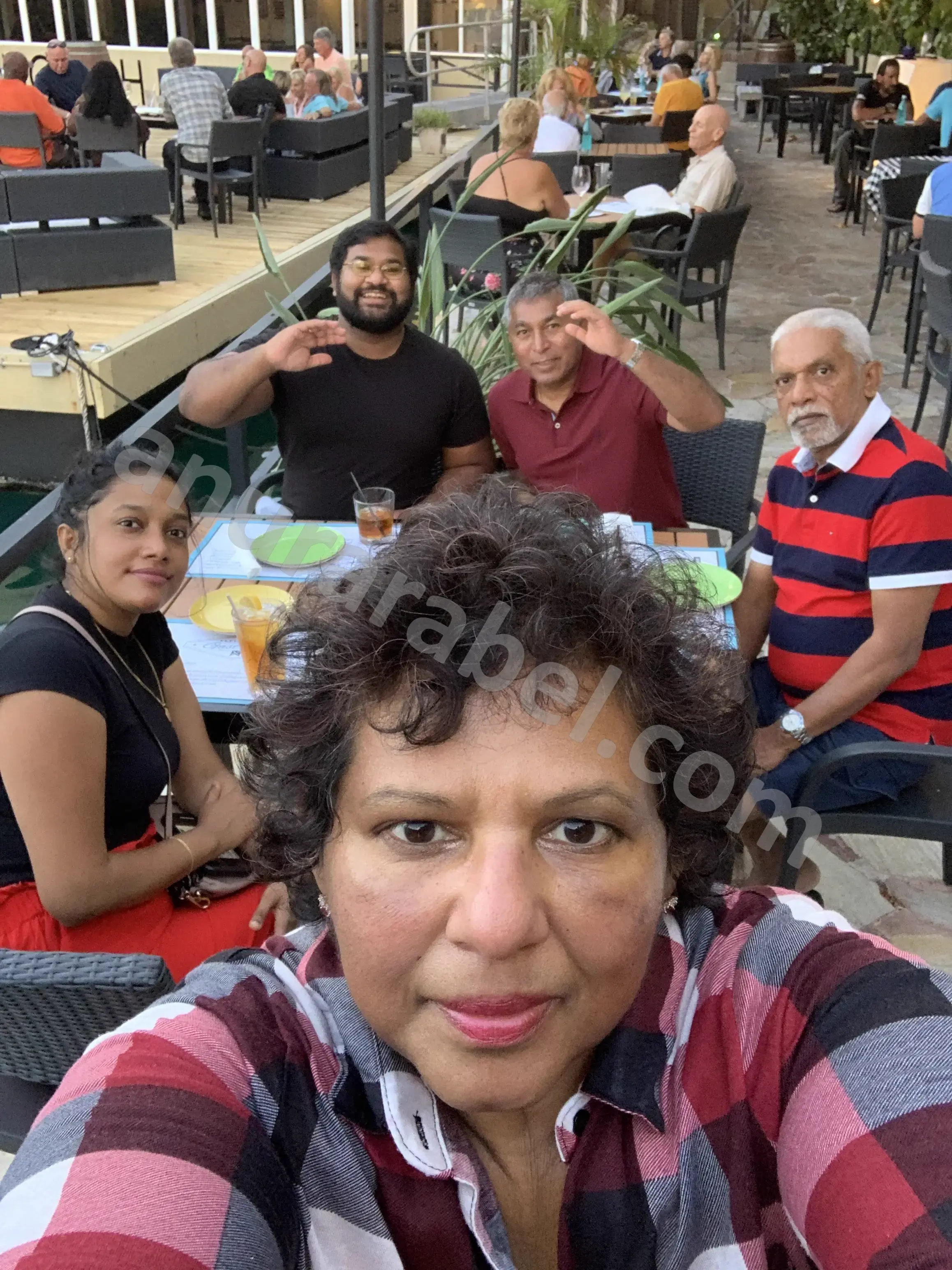 Anura with family Jayamini, Chamara, Ruwanthi, and Ruwanthi's dad at Flying 	Fish Gastrobar in Grand Bahama, Bahamas