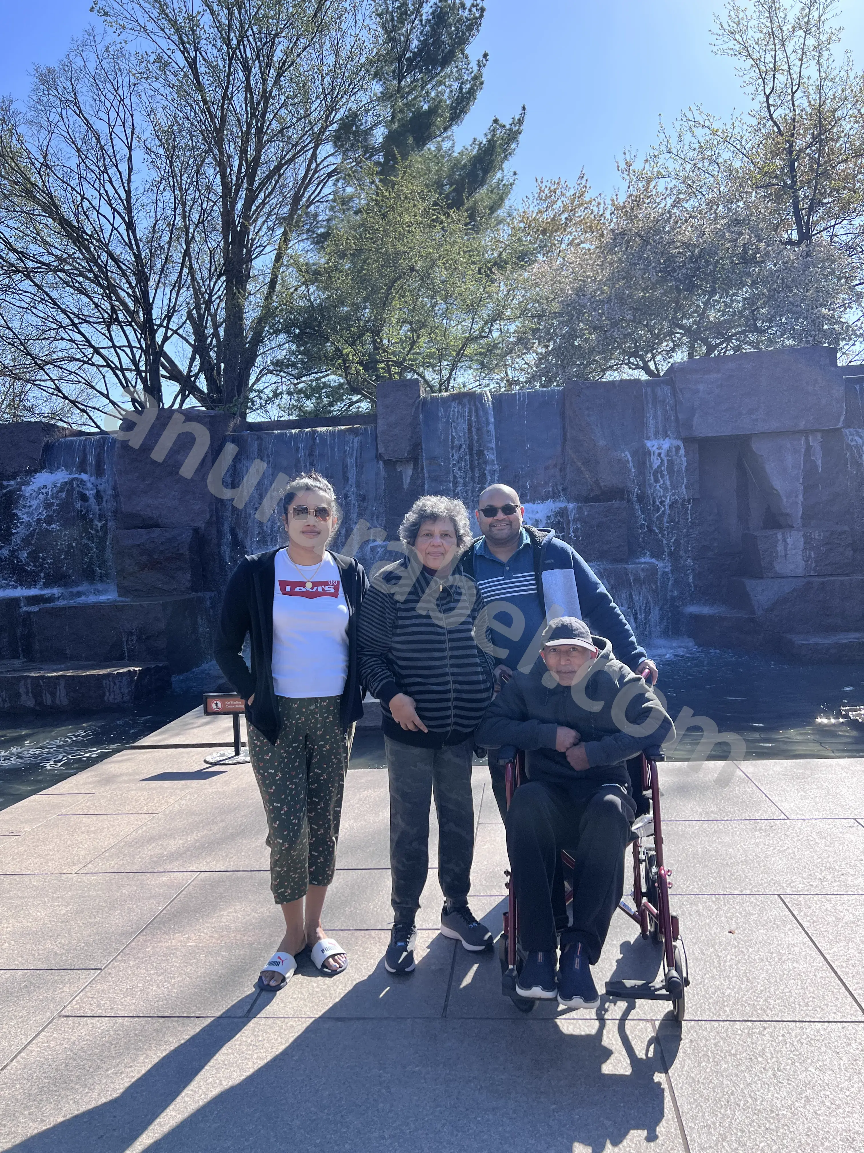 Anura with family Jayamini, Chamara, and Ruwanthi at Franklin Delano Roosevelt Memorial during Cherry Blossom Festival
